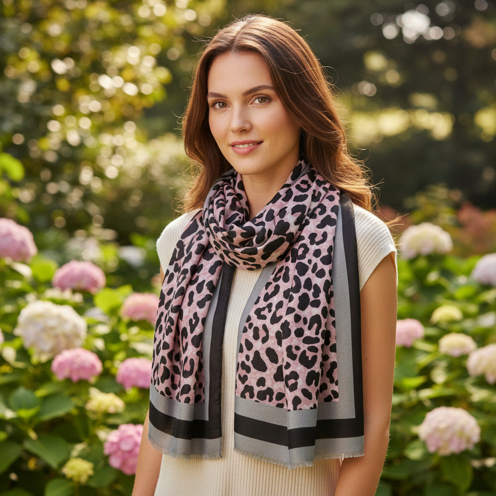 A leopard print scarf with soft cotton edges displayed on a white background.